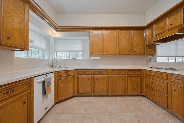 17718 Terrawren Ln, Spring, TX 77379 - kitchen featuring white appliances, brown cabinetry, and light countertops