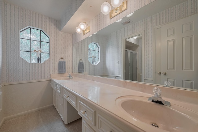 17718 Terrawren Ln, Spring, TX 77379 - full bathroom with wallpapered walls, plenty of natural light, double vanity, and a stall shower