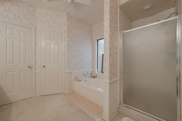 17718 Terrawren Ln, Spring, TX 77379 - bathroom with a stall shower, a garden tub, a ceiling fan, tile patterned flooring, and wallpapered walls