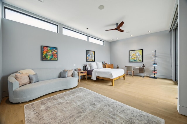 2332 Wroxton Rd, Houston, TX 77005 - bedroom featuring light wood-style flooring, recessed lighting, and a ceiling fan