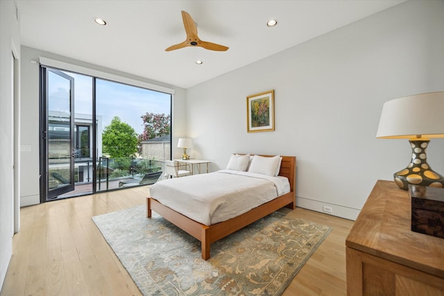 2332 Wroxton Rd, Houston, TX 77005 - bedroom featuring access to exterior, light wood finished floors, recessed lighting, a ceiling fan, and a wall of windows