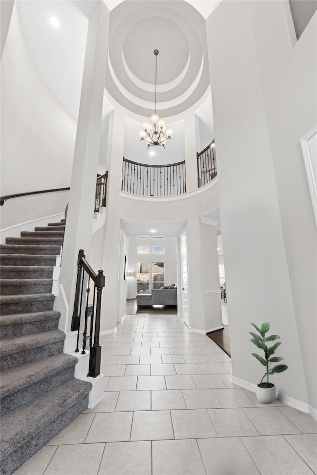 2131 Acadian Way, Brookshire, TX 77423 - tiled foyer entrance featuring a towering ceiling, stairway, and a chandelier