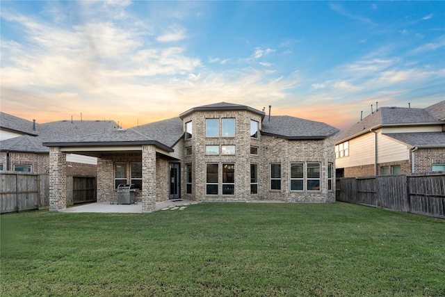 2131 Acadian Way, Brookshire, TX 77423 - back of property with a patio area, brick siding, a fenced backyard, and roof with shingles