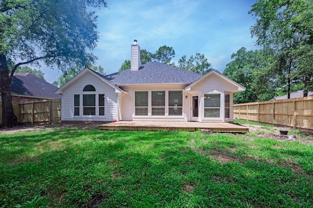 461 Cumberland Trl, Conroe, TX 77302 - rear view of house featuring a fenced backyard, a wooden deck, a chimney, and a shingled roof