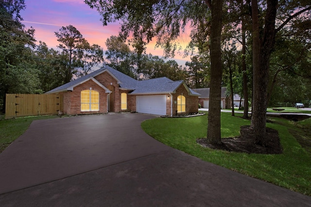 461 Cumberland Trl, Conroe, TX 77302 - ranch-style home with driveway, an attached garage, a front yard, brick siding, and roof with shingles