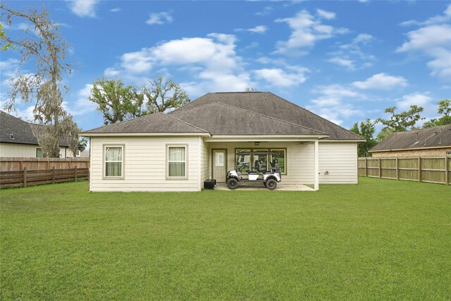 2234 Shalmar Dr, West Columbia, TX 77486 - rear view of property featuring a fenced backyard, a shingled roof, and a patio area