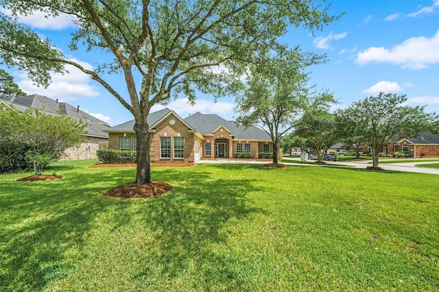 15331 Springhill Bend Ln, Cypress, TX 77429 - view of front of property featuring a front lawn and brick siding