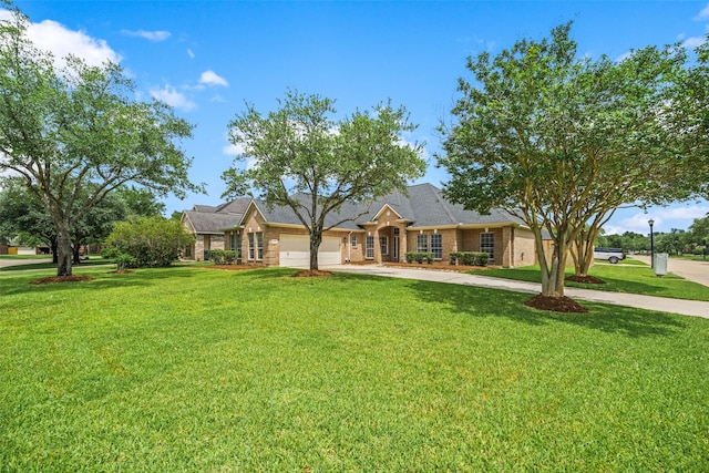 15331 Springhill Bend Ln, Cypress, TX 77429 - view of front of home featuring driveway, a garage, a front lawn, and brick siding