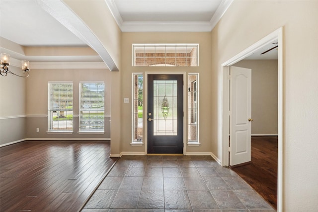 15331 Springhill Bend Ln, Cypress, TX 77429 - foyer entrance with crown molding, arched walkways, wood finished floors, and a chandelier