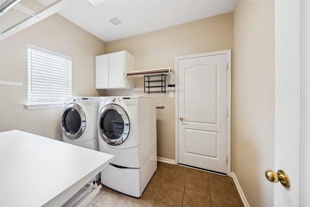 15331 Springhill Bend Ln, Cypress, TX 77429 - laundry area featuring cabinet space, separate washer and dryer, and light tile patterned flooring