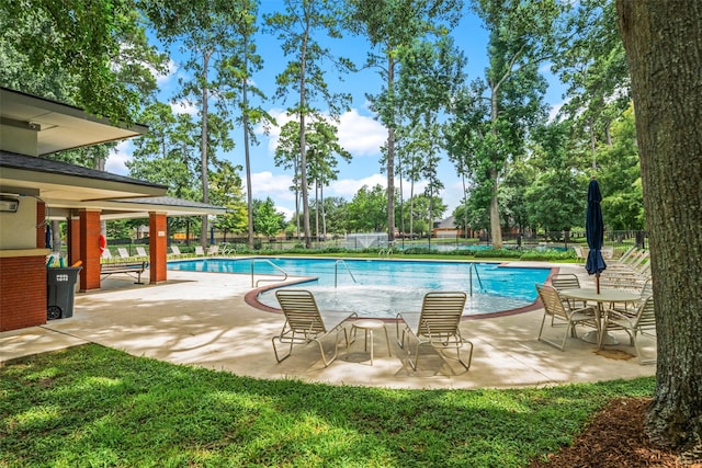 15331 Springhill Bend Ln, Cypress, TX 77429 - community pool with a fenced backyard and a patio