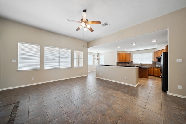 15331 Springhill Bend Ln, Cypress, TX 77429 - kitchen featuring open floor plan, freestanding refrigerator, ceiling fan, dark countertops, and recessed lighting