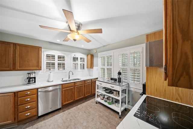 1621 Cherryhurst St, Houston, TX 77006 - kitchen with stainless steel dishwasher, brown cabinets, tasteful backsplash, a ceiling fan, and light countertops
