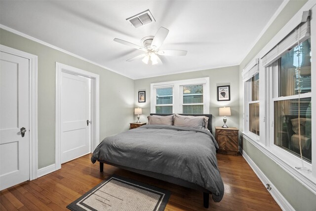 1621 Cherryhurst St, Houston, TX 77006 - bedroom with wood finished floors, crown molding, and a ceiling fan