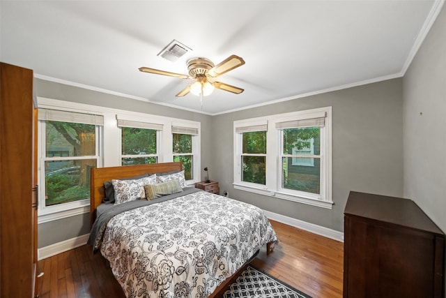 1621 Cherryhurst St, Houston, TX 77006 - bedroom with wood-type flooring, ornamental molding, and ceiling fan
