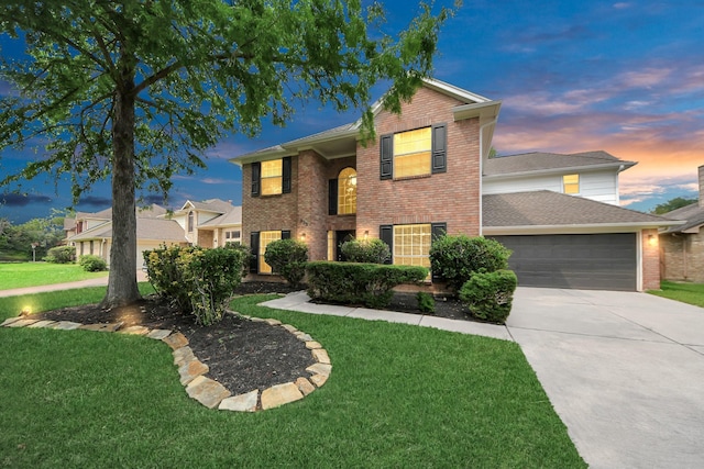 235 Cedar Elm Ln, Sugar Land, TX 77479 - traditional home featuring brick siding, a garage, a lawn, and driveway