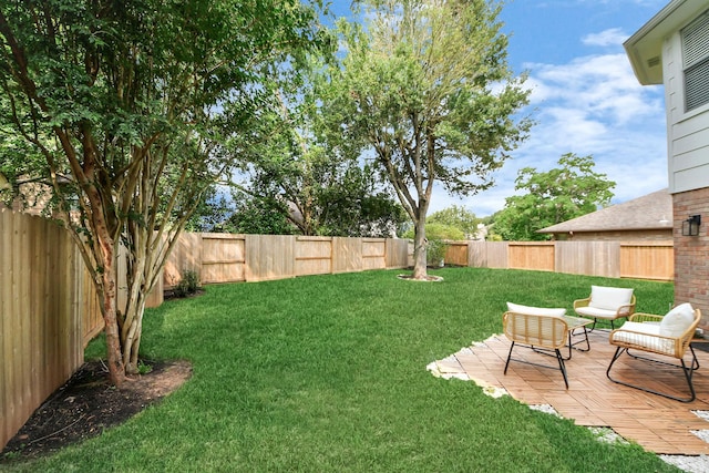 235 Cedar Elm Ln, Sugar Land, TX 77479 - fenced backyard with a patio