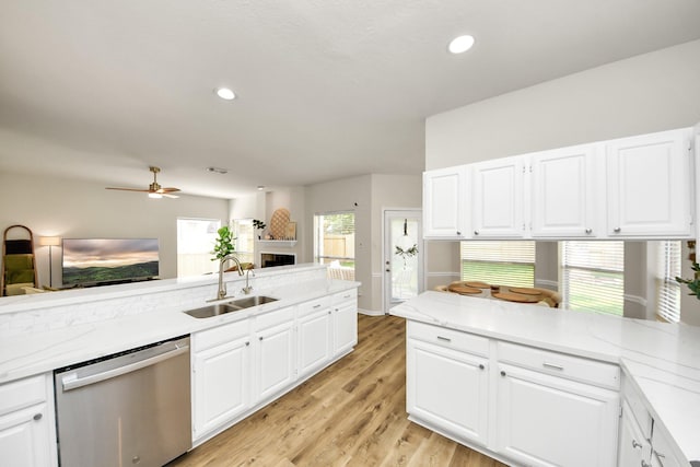 235 Cedar Elm Ln, Sugar Land, TX 77479 - kitchen with dishwasher, white cabinets, light wood finished floors, and recessed lighting