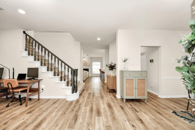235 Cedar Elm Ln, Sugar Land, TX 77479 - entryway with wood finished floors, stairway, recessed lighting, and a fireplace