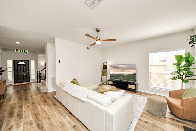 235 Cedar Elm Ln, Sugar Land, TX 77479 - living area with light wood finished floors, a ceiling fan, stairs, and recessed lighting