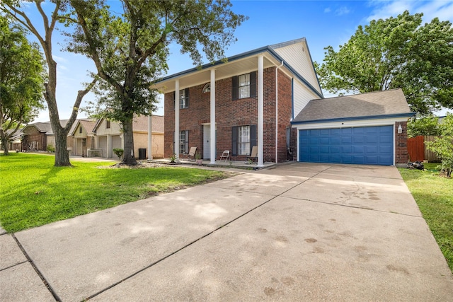3825 Redbud Dr, La Porte, TX 77571 - greek revival house featuring brick siding, driveway, a garage, and covered porch