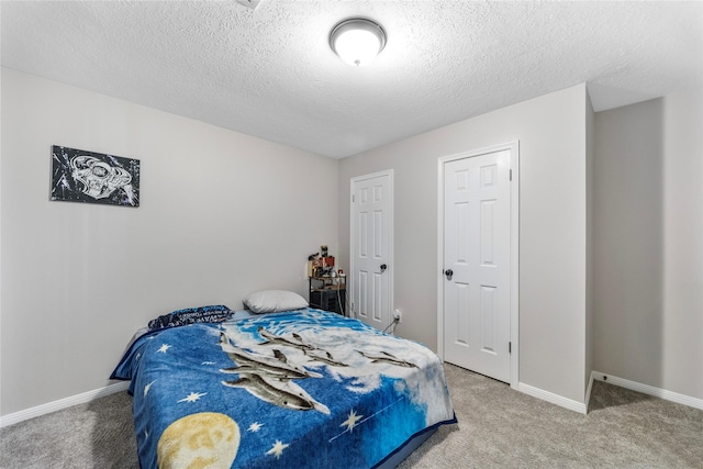 3825 Redbud Dr, La Porte, TX 77571 - bedroom with carpet floors and a textured ceiling