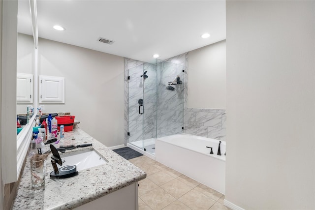 3825 Redbud Dr, La Porte, TX 77571 - bathroom featuring vanity, a shower stall, a bath, tile patterned flooring, and recessed lighting