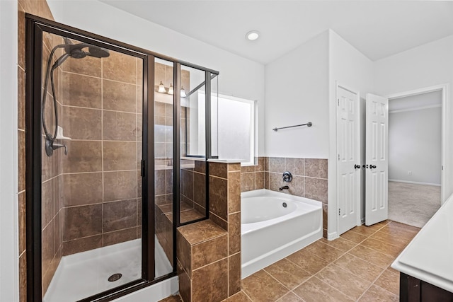 9203 Sasson Blvd, Houston, TX 77044 - full bath with a bath, a stall shower, vanity, tile patterned floors, and recessed lighting