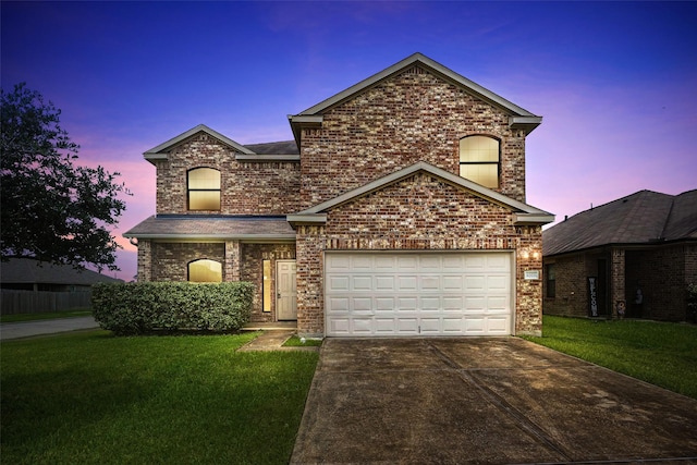 9203 Sasson Blvd, Houston, TX 77044 - view of front of property featuring driveway, a front lawn, brick siding, and a garage