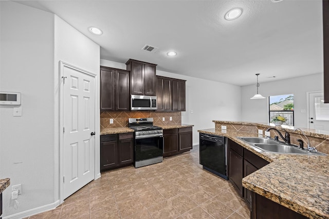 9203 Sasson Blvd, Houston, TX 77044 - kitchen with appliances with stainless steel finishes, decorative backsplash, dark brown cabinetry, decorative light fixtures, and recessed lighting