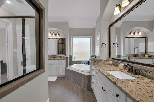31268 New Forest Park Ln, Spring, TX 77386 - bathroom with two vanities and a garden tub