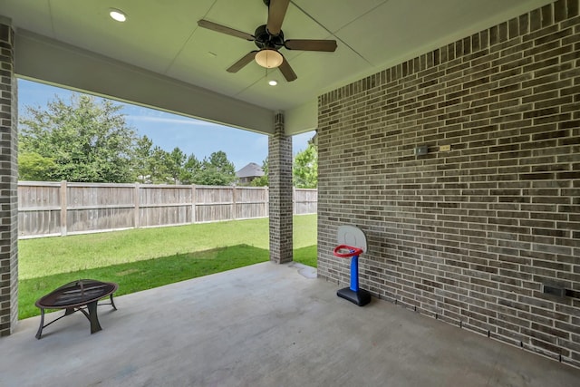 31268 New Forest Park Ln, Spring, TX 77386 - fenced backyard with a ceiling fan, a patio area, and an outdoor fire pit