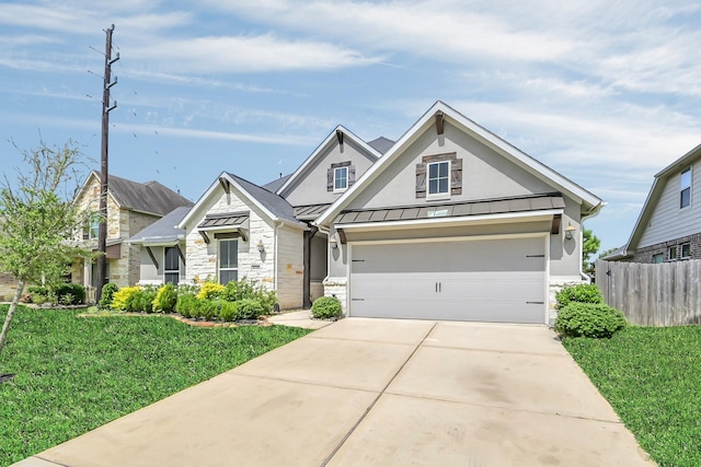 31268 New Forest Park Ln, Spring, TX 77386 - view of front of property featuring stone siding, a standing seam roof, concrete driveway, a metal roof, and an attached garage