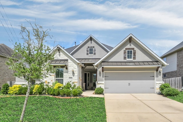 31268 New Forest Park Ln, Spring, TX 77386 - view of front of property with a standing seam roof, stone siding, driveway, and a metal roof