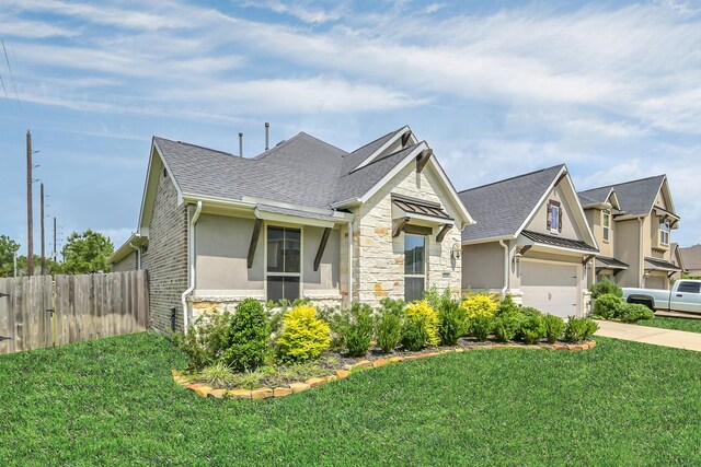 31268 New Forest Park Ln, Spring, TX 77386 - view of front of home with stone siding, driveway, stucco siding, and a shingled roof
