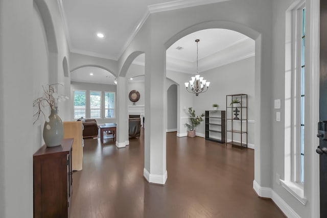 31268 New Forest Park Ln, Spring, TX 77386 - entryway with arched walkways, crown molding, dark wood-type flooring, recessed lighting, and a chandelier