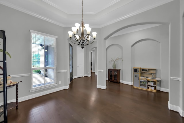 31268 New Forest Park Ln, Spring, TX 77386 - unfurnished dining area with wood finished floors, a chandelier, a tray ceiling, and crown molding