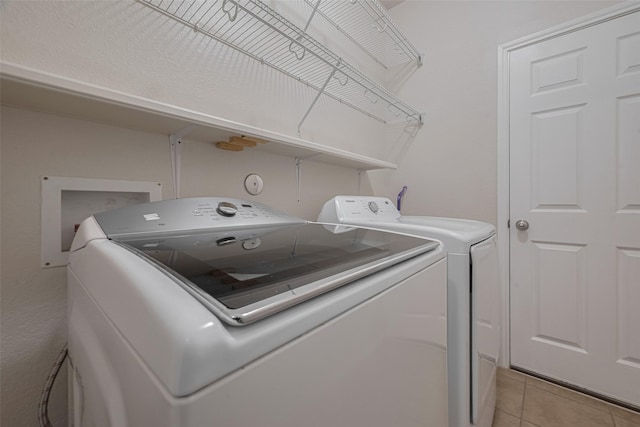 5830 Acacia Rose Ct, Richmond, TX 77407 - laundry area featuring independent washer and dryer and light tile patterned floors