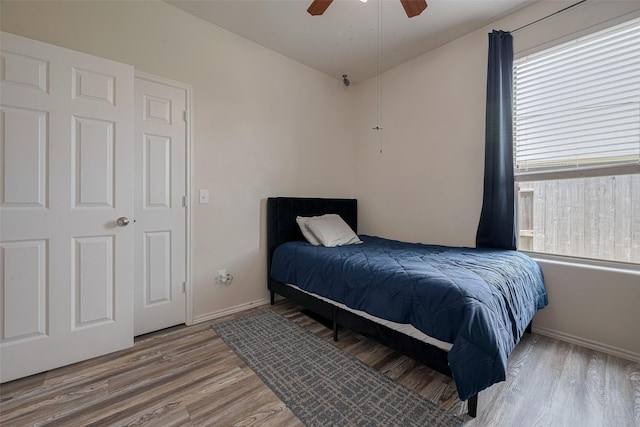 5830 Acacia Rose Ct, Richmond, TX 77407 - bedroom featuring wood finished floors and a ceiling fan