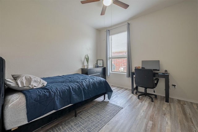 5830 Acacia Rose Ct, Richmond, TX 77407 - bedroom featuring wood finished floors, ceiling fan, and a desk