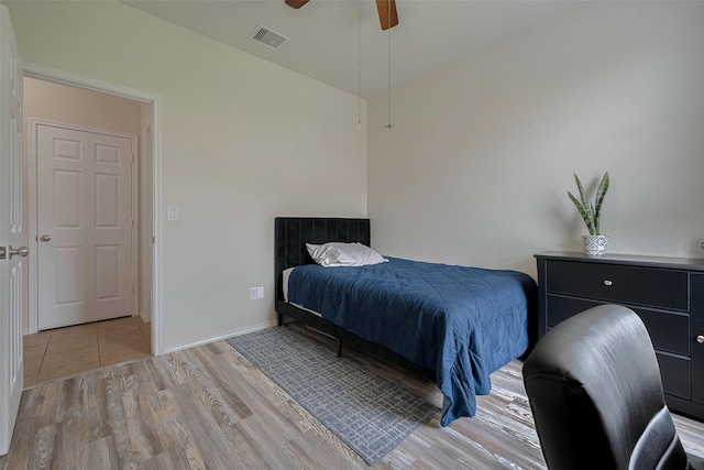 5830 Acacia Rose Ct, Richmond, TX 77407 - bedroom with light wood-style floors and ceiling fan