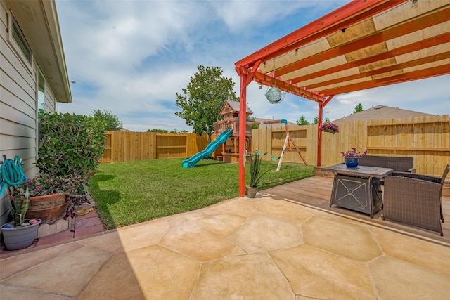 5830 Acacia Rose Ct, Richmond, TX 77407 - fenced backyard featuring a playground and a patio area