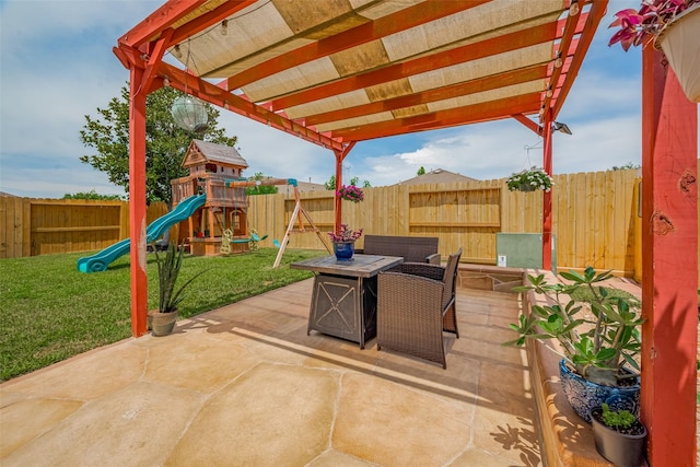 5830 Acacia Rose Ct, Richmond, TX 77407 - fenced backyard with a playground, a patio area, an outdoor fire pit, and a pergola