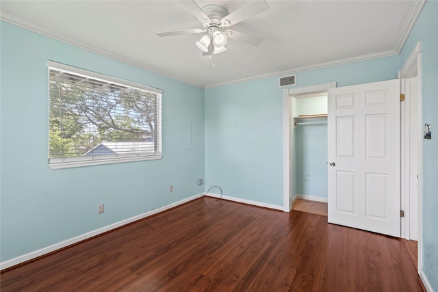 119 8th St, San Leon, TX 77539 - unfurnished bedroom with wood finished floors, ornamental molding, a closet, and a ceiling fan
