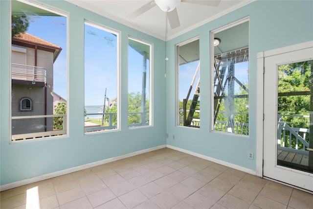 119 8th St, San Leon, TX 77539 - unfurnished room featuring a ceiling fan, tile patterned floors, and crown molding