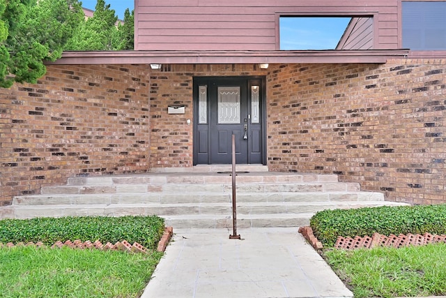 12 E Dansby Dr, Galveston, TX 77551 - property entrance with brick siding