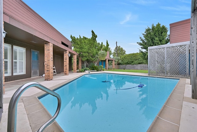 12 E Dansby Dr, Galveston, TX 77551 - view of swimming pool with a patio area and a diving board