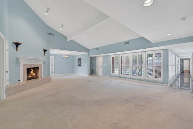 12 E Dansby Dr, Galveston, TX 77551 - unfurnished living room with a premium fireplace, carpet floors, high vaulted ceiling, recessed lighting, and a chandelier