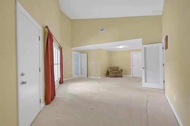 12 E Dansby Dr, Galveston, TX 77551 - unfurnished room with light carpet and a towering ceiling