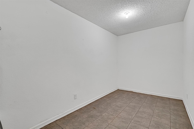 12 E Dansby Dr, Galveston, TX 77551 - unfurnished room with a textured ceiling and baseboards
